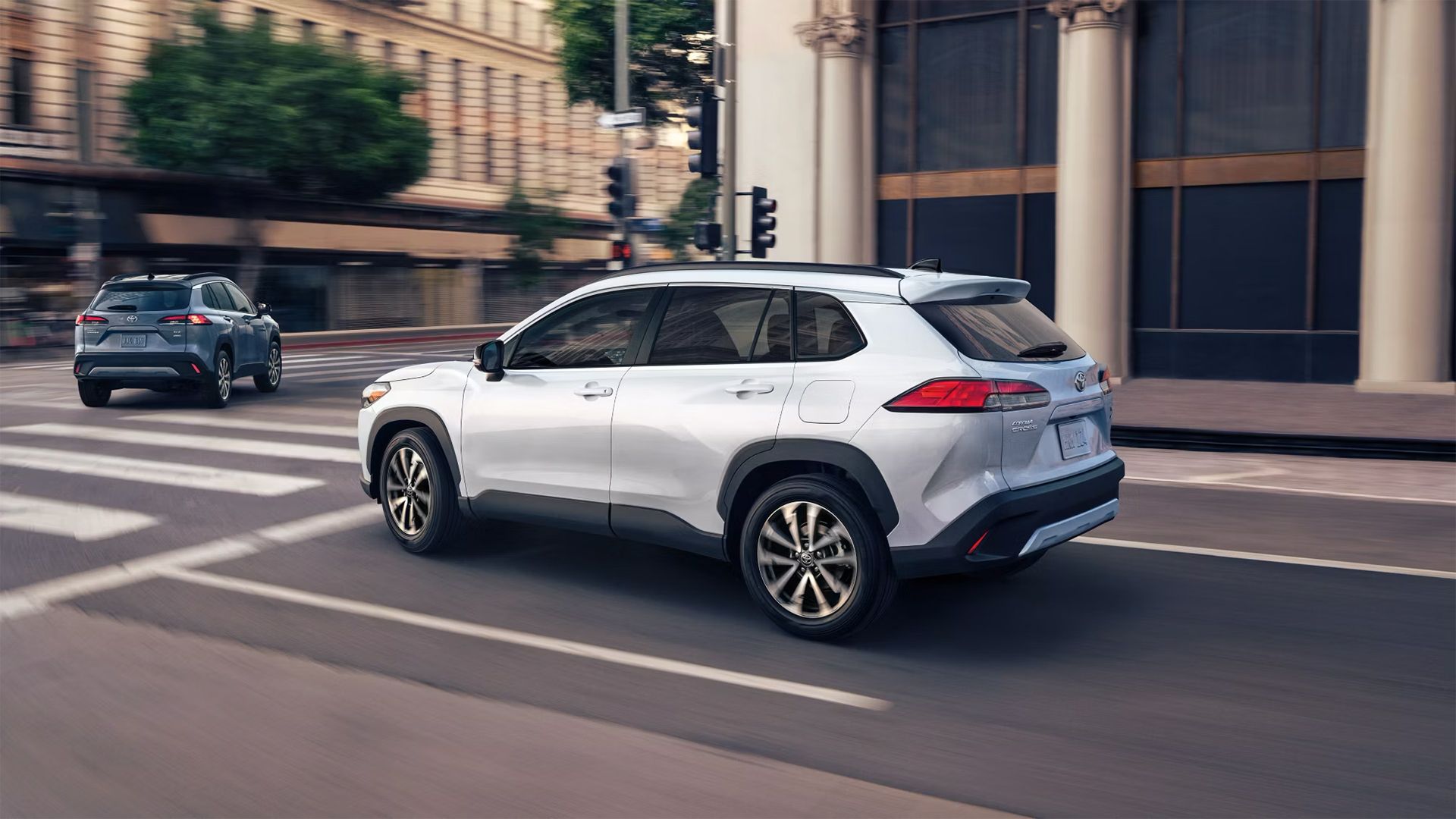 A white 2025 Toyota Corolla Cross Hybrid 