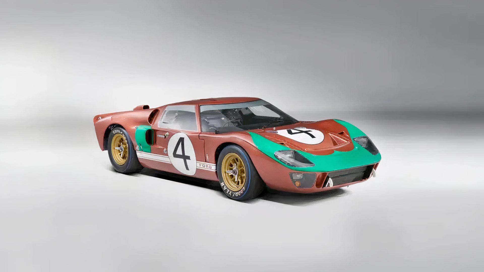 1966 Ford GT40 Mark II in green and red parked in studio