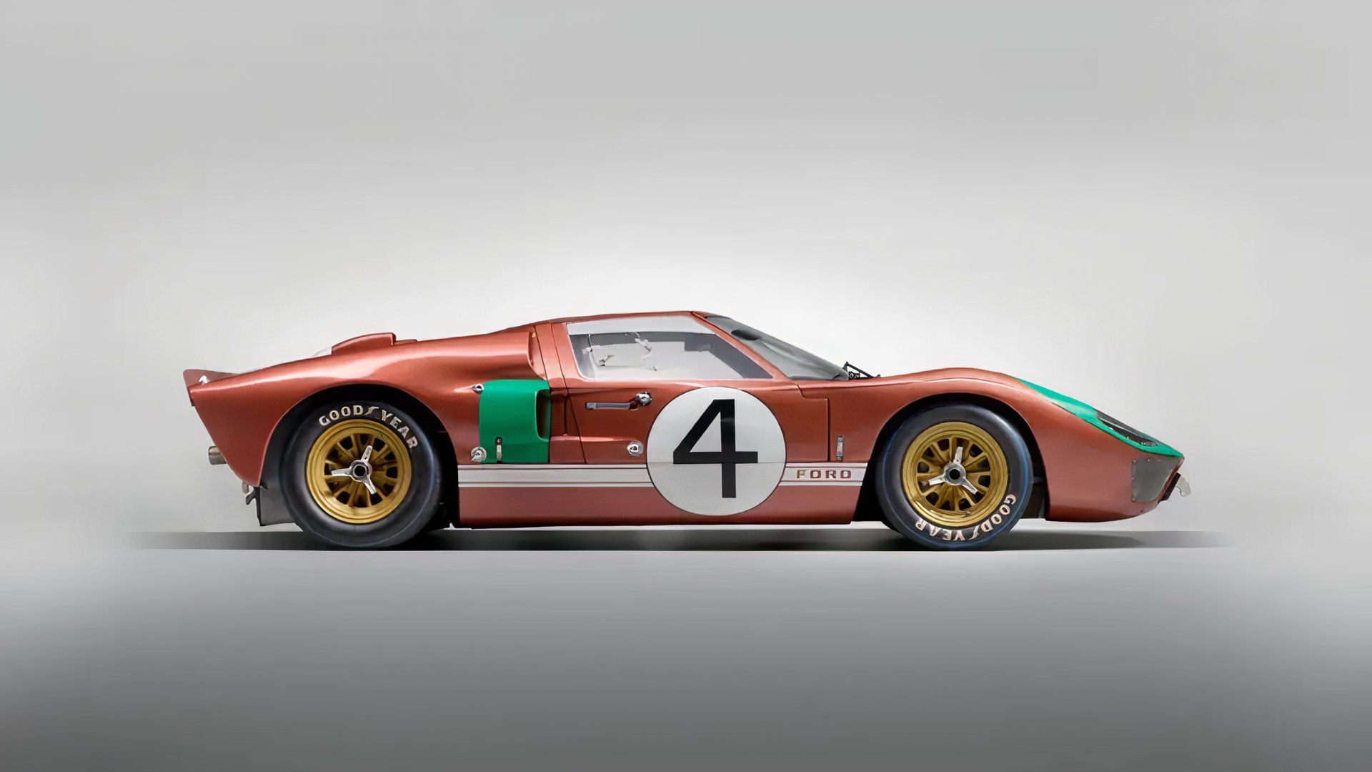 1966 Ford GT40 Mark II in green and red parked in studio