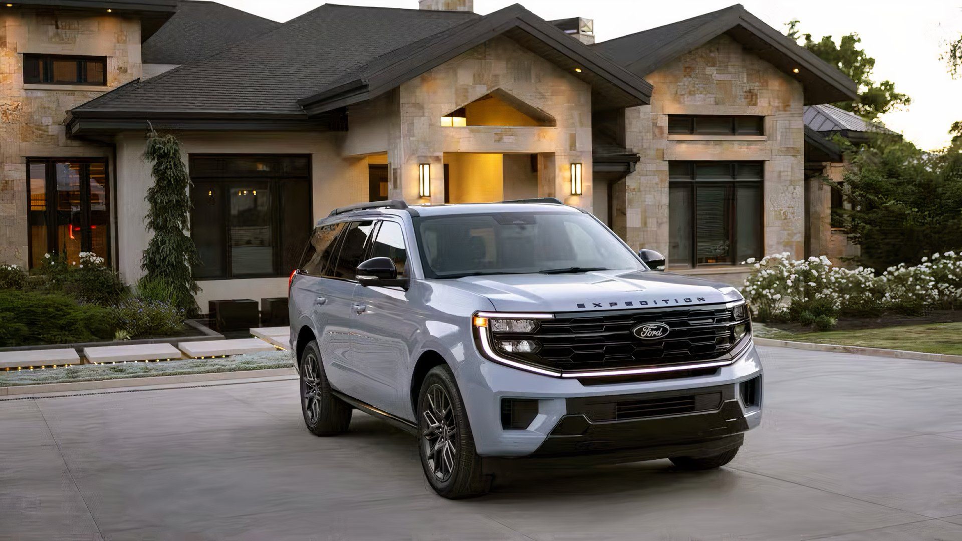 2025 Ford Expedition in white parked outside the house