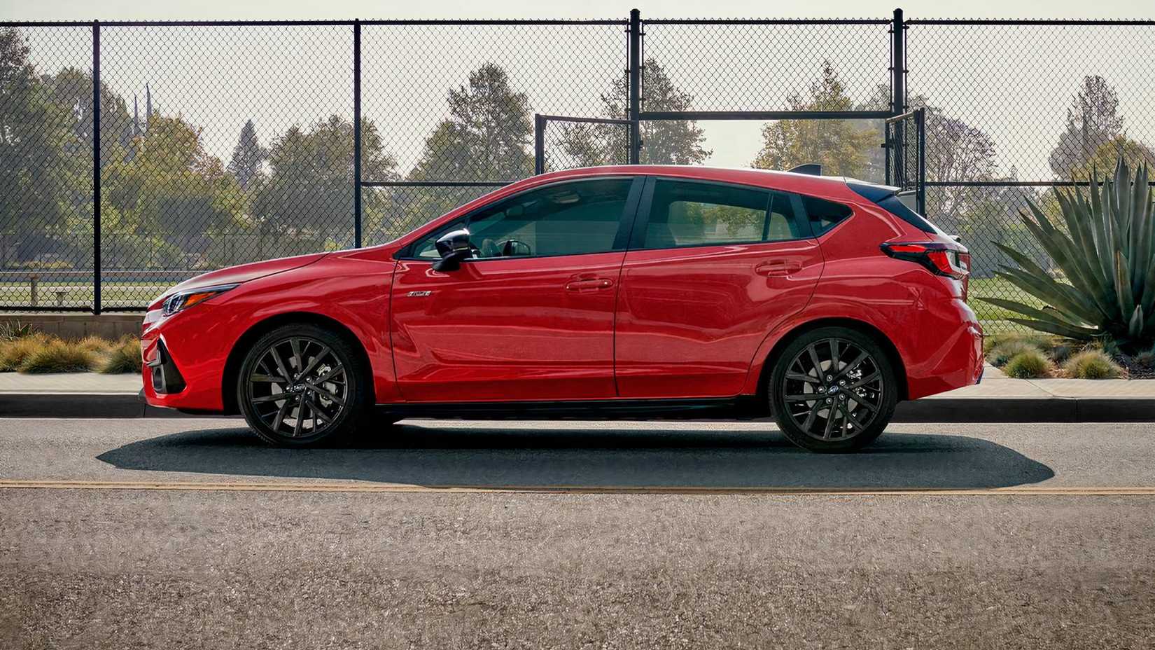 2026 Subaru Impreza RS in red parked on road