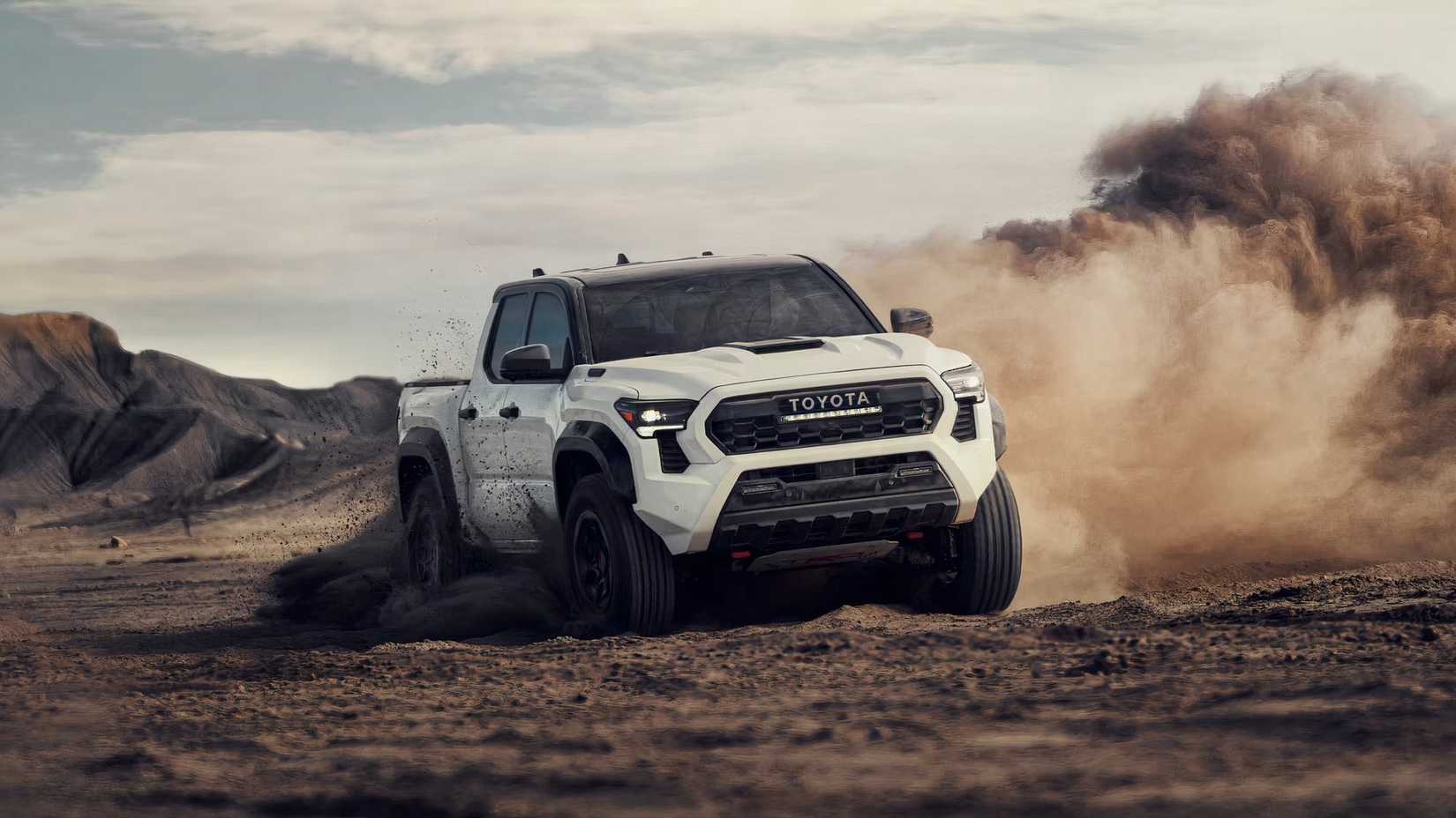 2025 Toyota Tacoma TRD Pro in white driving through desert