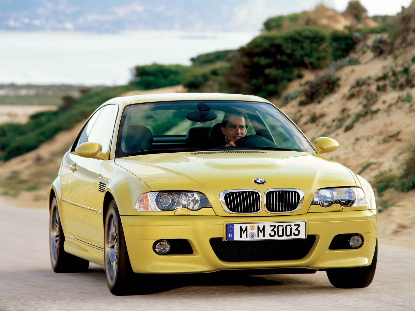 Yellow BMW E46 M3 driving