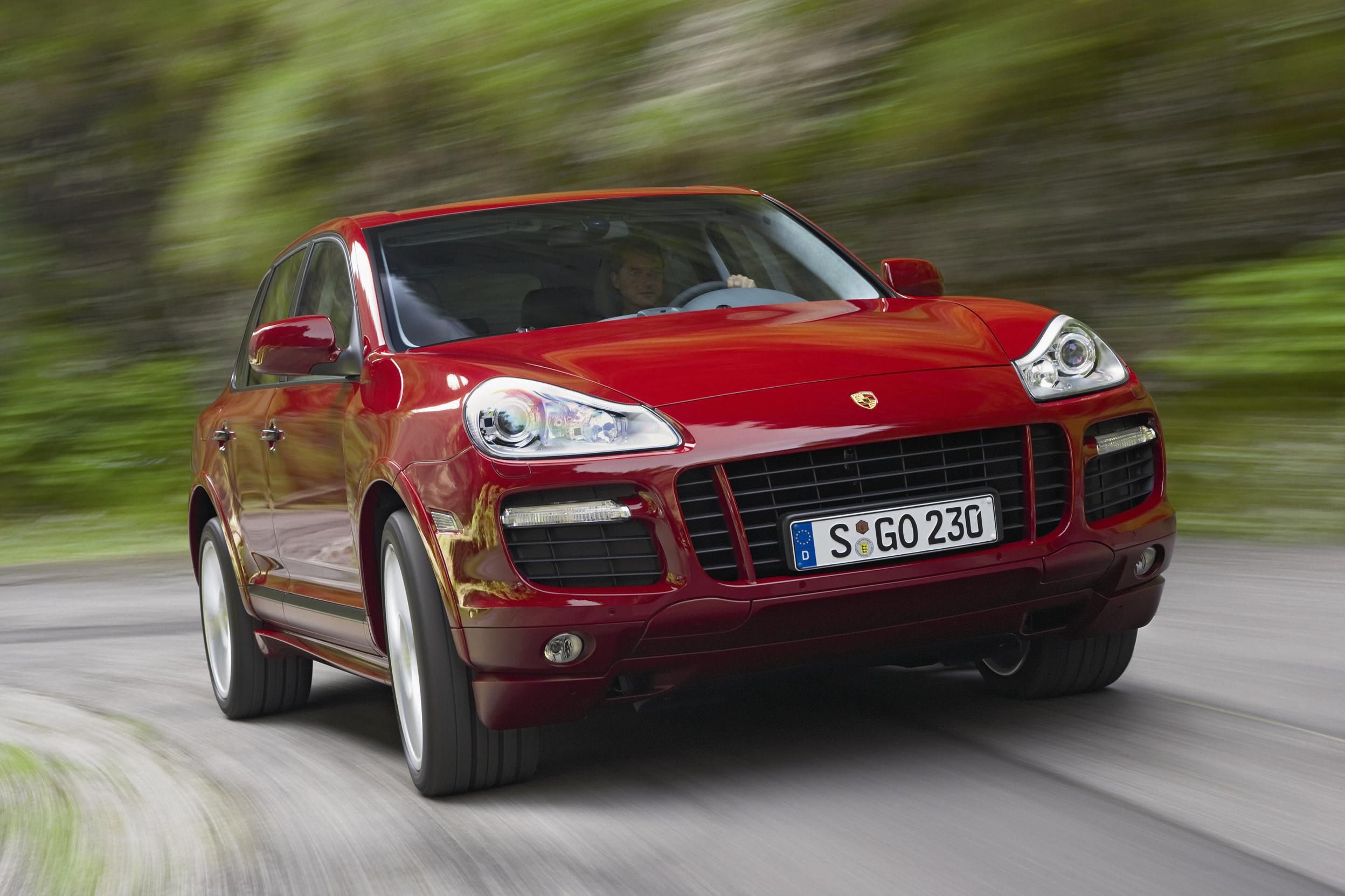 A Porsche Cayenne GTS driving a country road 