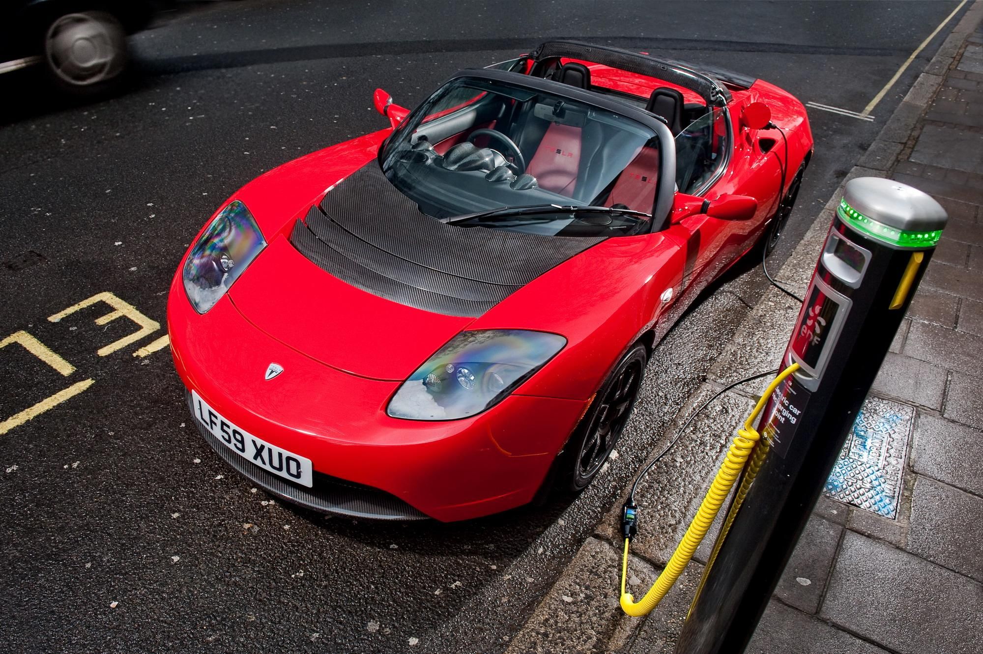 Tesla Roadster parked on the street