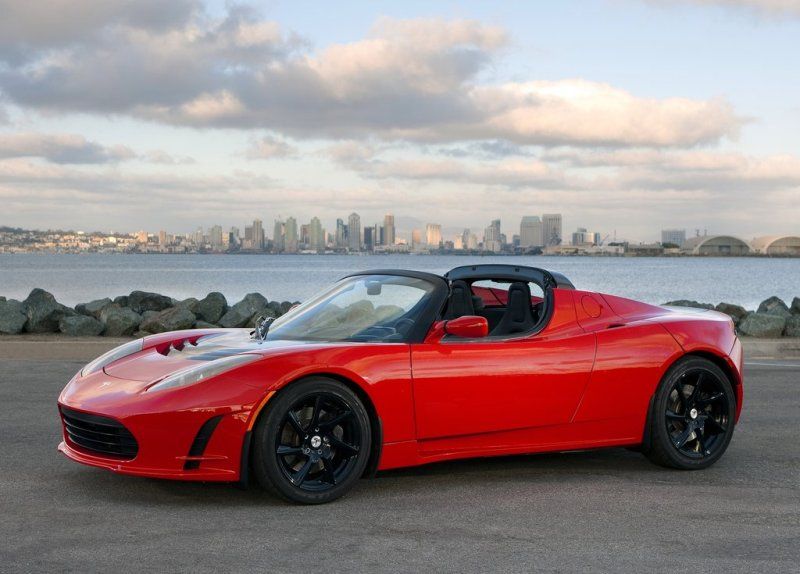 Red Tesla Roadster Parked