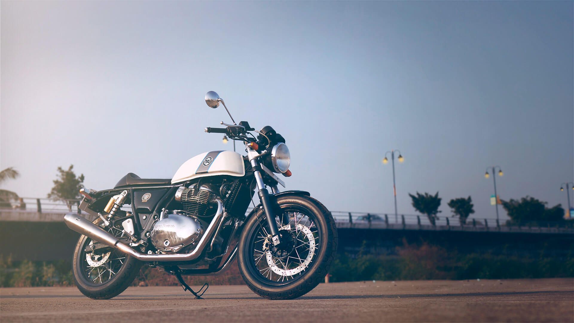 White Royal Enfield Continental GT 650 posed for a shot against the sky