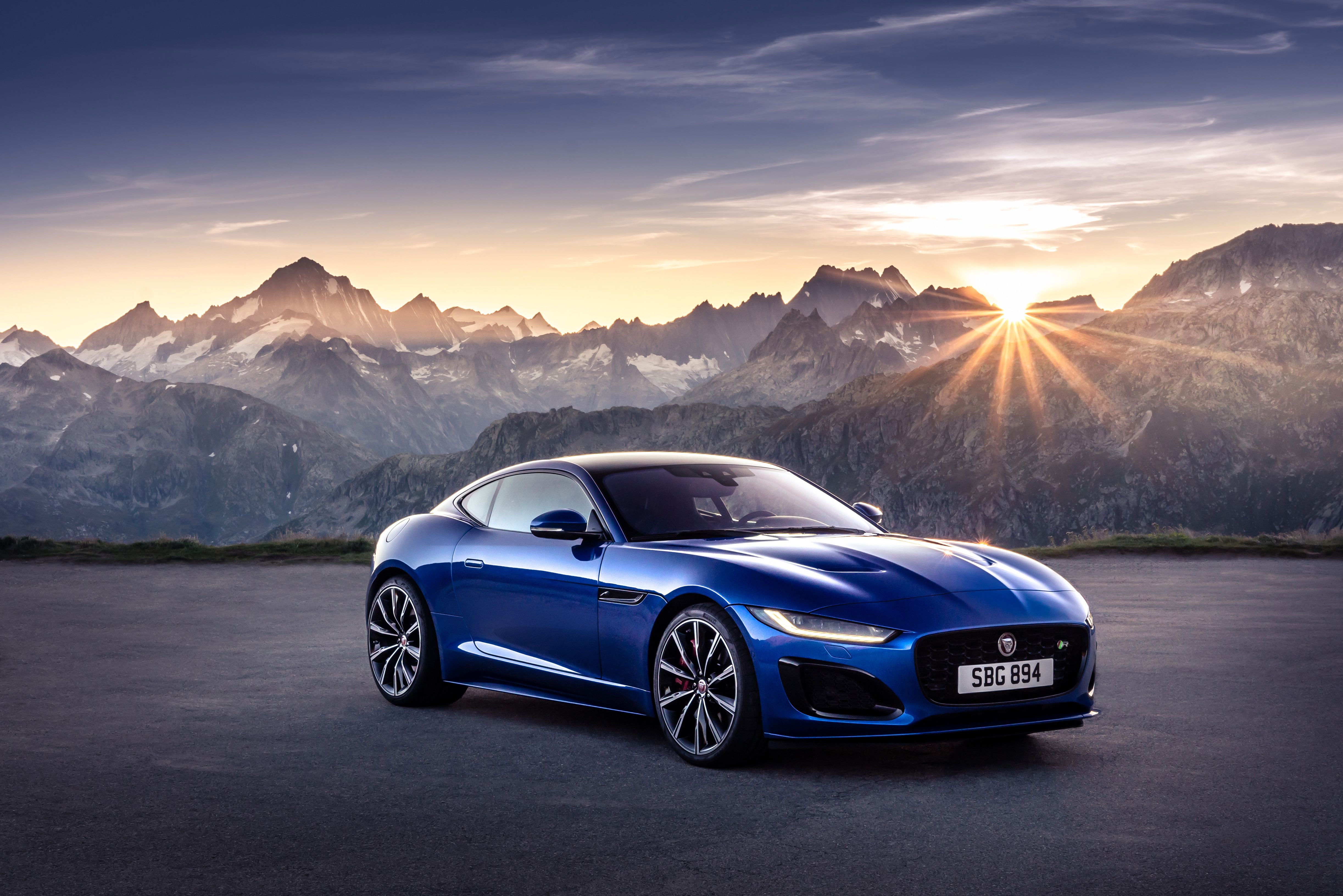 blue Jaguar F-Type Coupe parked on a summit