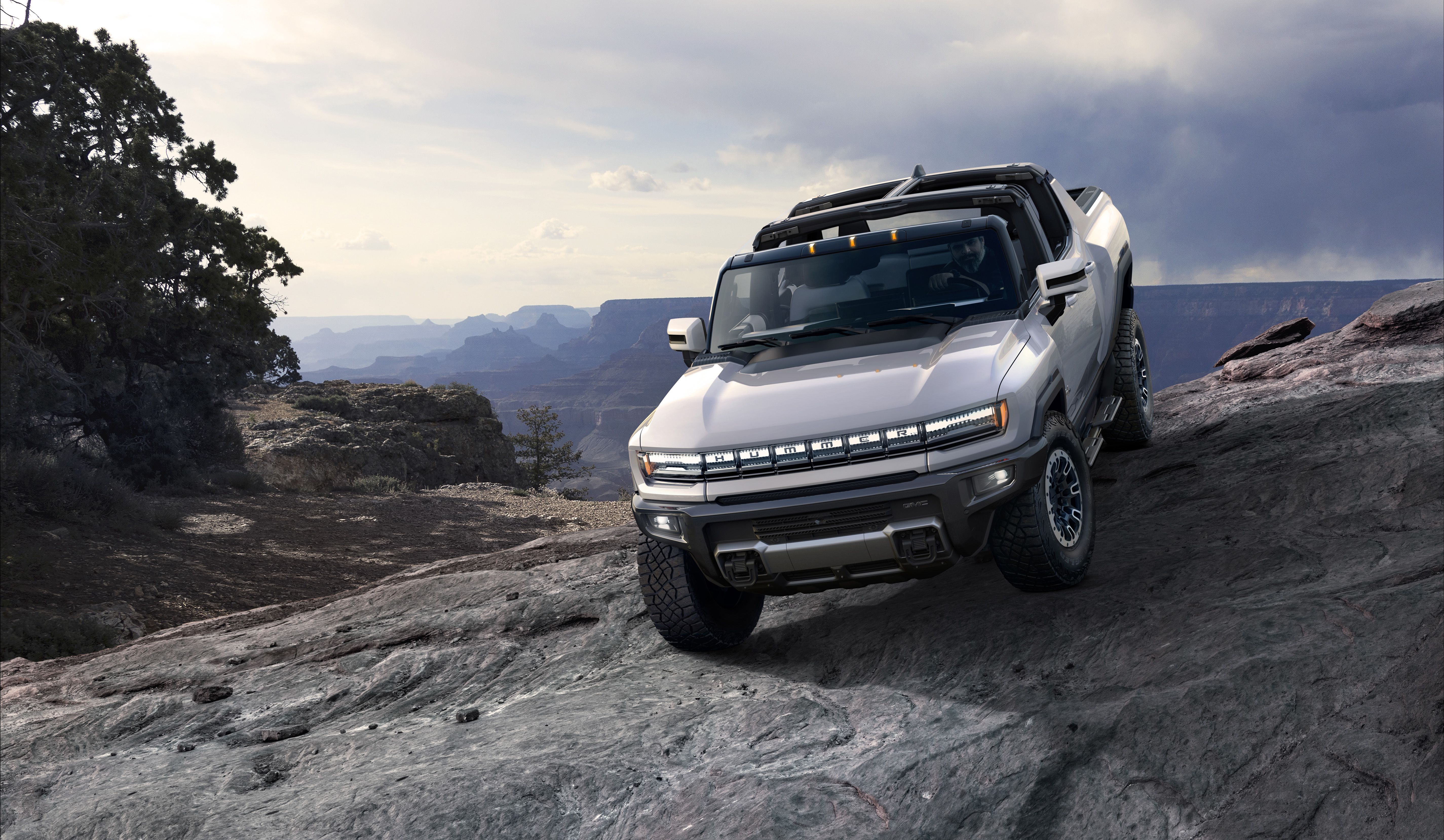 2022 GMC Hummer EV pickup truck on a rough terrain