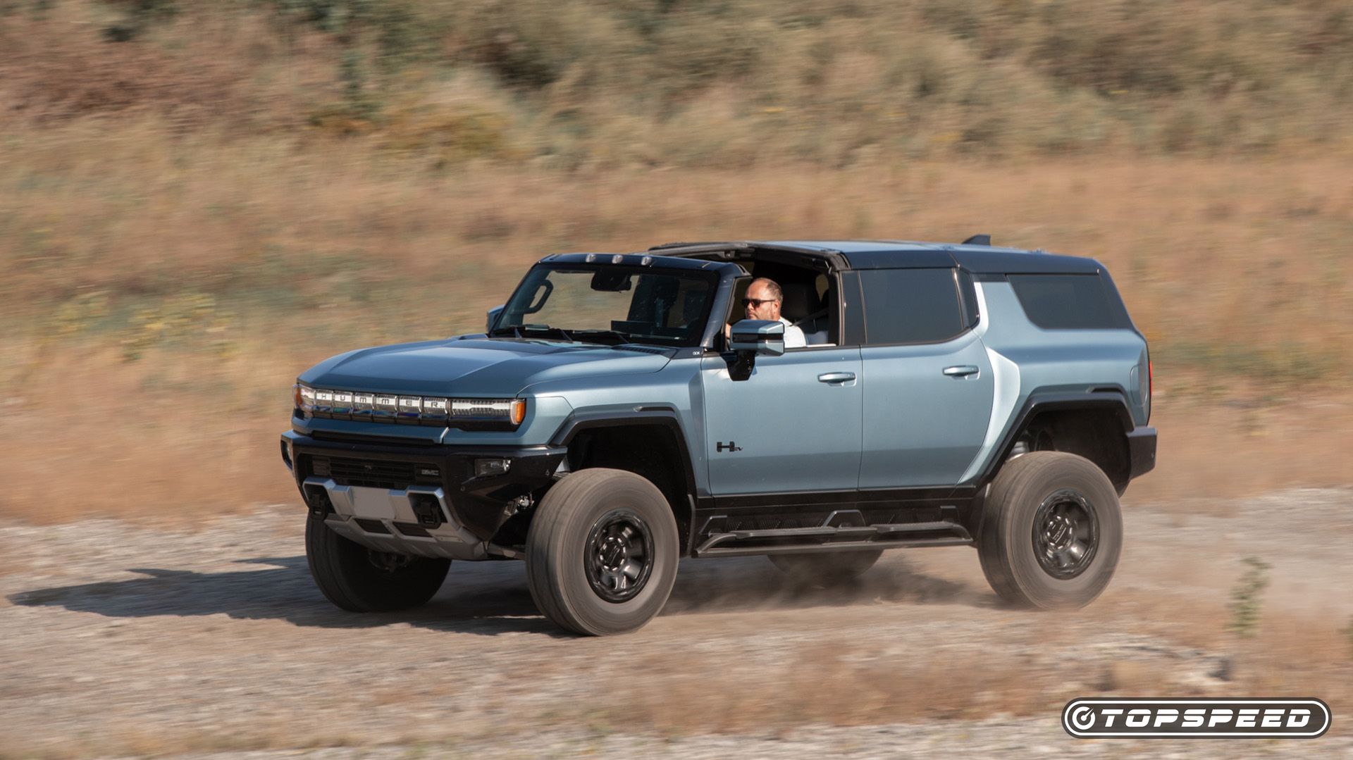 2024 GMC Hummer EV SUV Driving Front Side TopSpeed