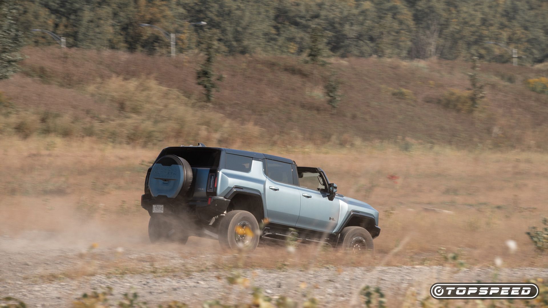 2024 GMC Hummer EV SUV Driving Rear TopSpeed